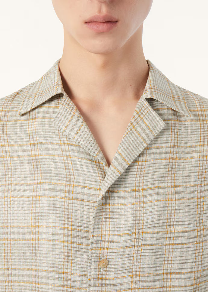 Piha Shirt styled on model, relaxed fit linen Cuban collar shirt in Sand colour
